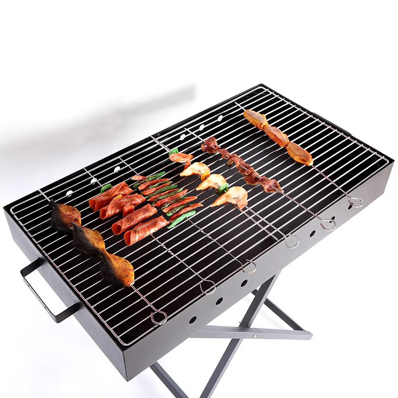 Parrilla de barbacoa en forma de X portátil plegable de acero inoxidable