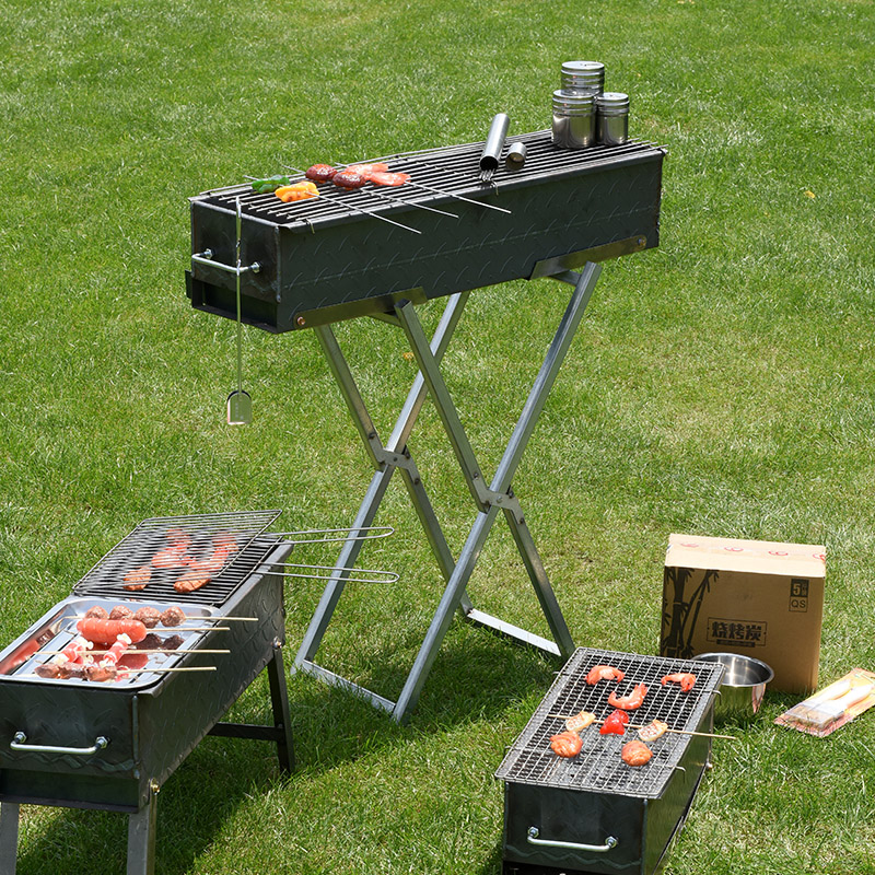 Parrilla de barbacoa en forma de X portátil plegable de acero inoxidable